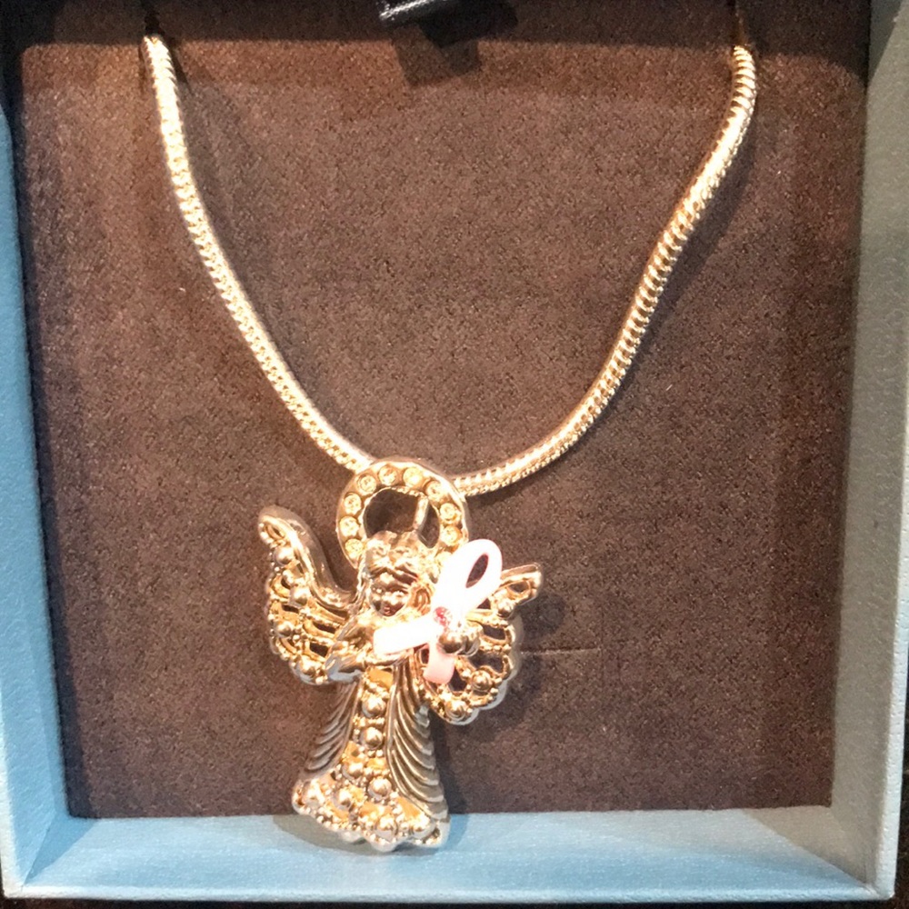 Fashion Jewelry- breast cancer angel pendant doubles as a charm or pin.